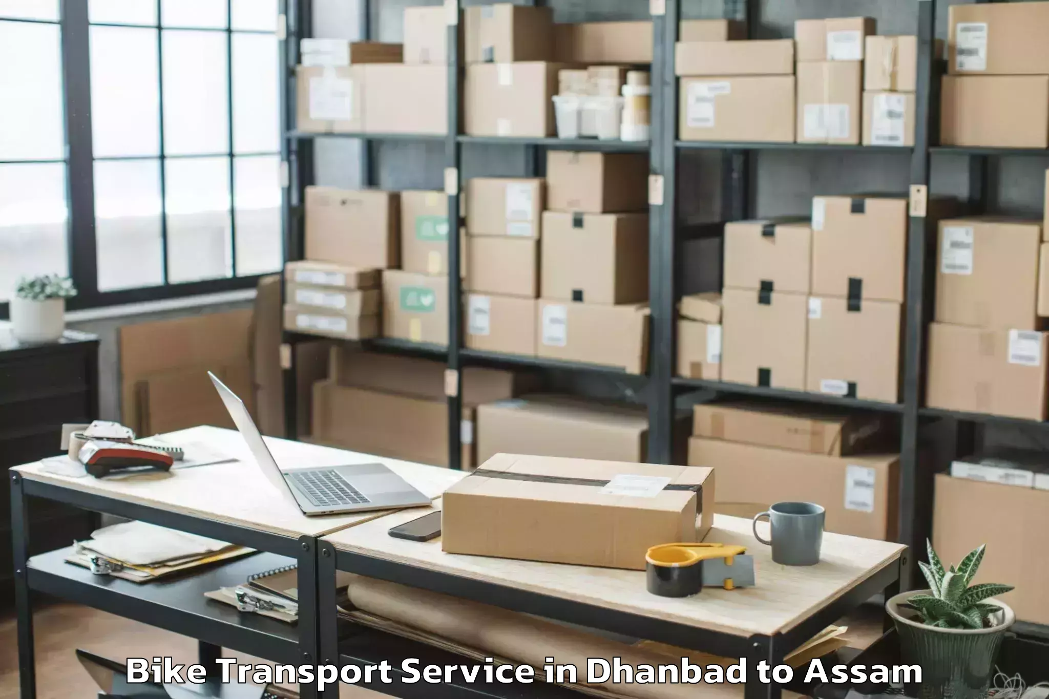 Reliable Dhanbad to Balipara Bike Transport